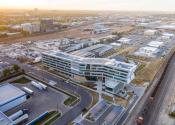 A complex of buildings seen at sunrise in an aerial shot of Denver Water's Operations Complex. 